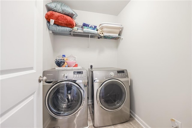 laundry room with separate washer and dryer