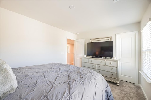 bedroom featuring light colored carpet