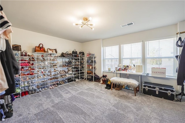 interior space with an inviting chandelier and carpet