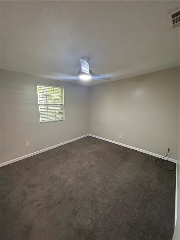 1182 Sims St SW, Atlanta, GA 30310 - spare room with dark carpet, baseboards, and a ceiling fan