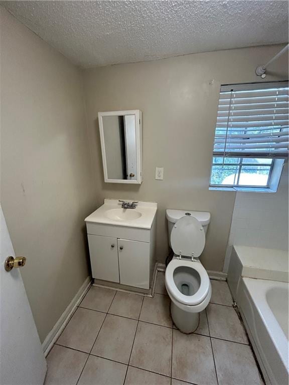 1182 Sims St SW, Atlanta, GA 30310 - full bathroom featuring a textured ceiling, vanity, toilet, a tub, and tile patterned floors
