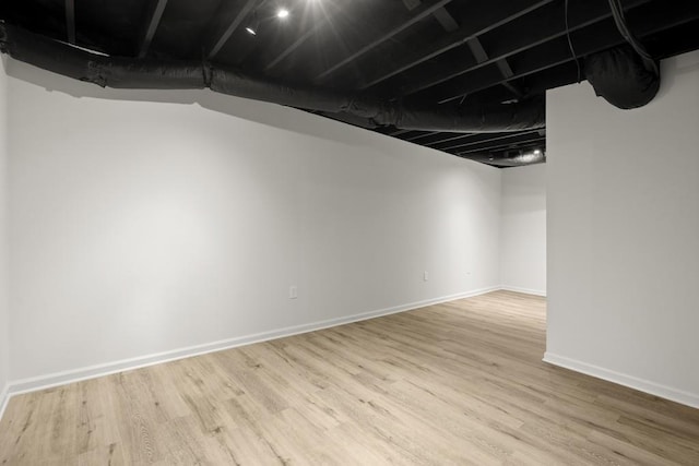 basement with wood-type flooring