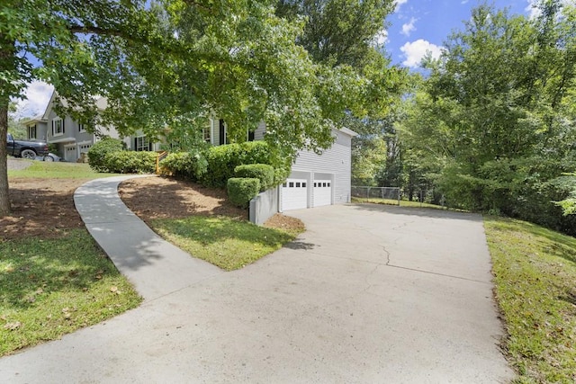 view of side of home featuring a garage