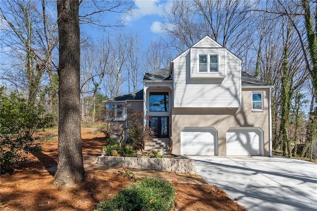 view of front of property with brick siding, concrete driveway, and an attached garage