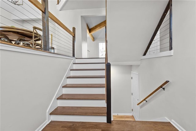 staircase with wood finished floors