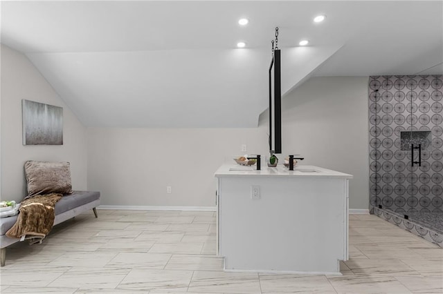 bathroom with a tile shower, recessed lighting, baseboards, vanity, and vaulted ceiling