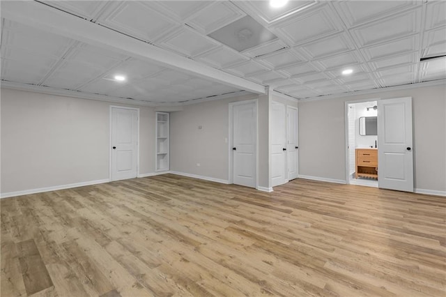 finished below grade area with recessed lighting, baseboards, and light wood-type flooring