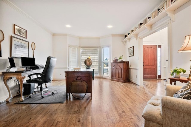 office area with hardwood / wood-style floors and ornamental molding