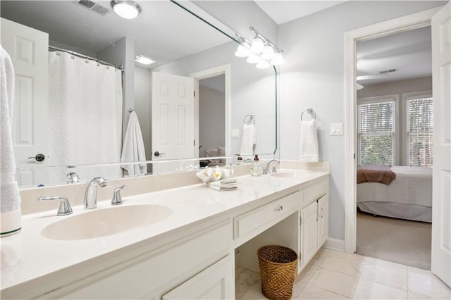 bathroom with vanity and tile patterned floors