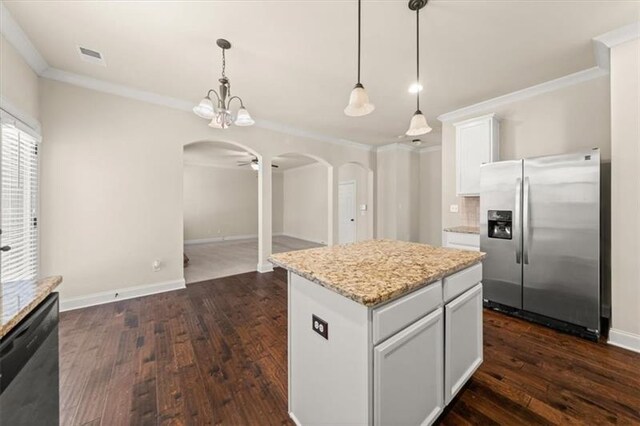 kitchen with crown molding, arched walkways, stainless steel fridge, and dishwashing machine