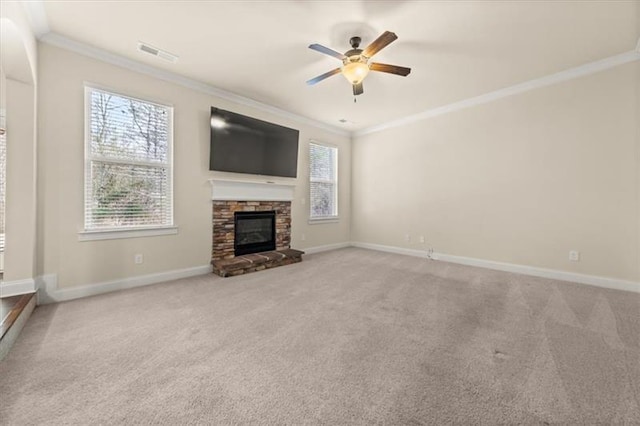 unfurnished living room featuring carpet flooring, a ceiling fan, baseboards, visible vents, and ornamental molding