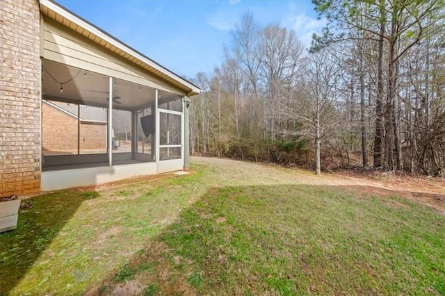 view of yard with a sunroom