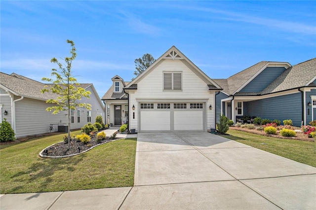 view of front of house featuring an attached garage, central AC unit, driveway, and a front yard