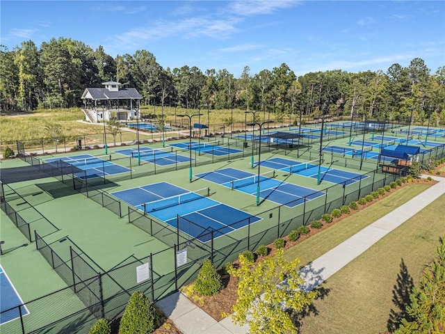 view of tennis court with fence
