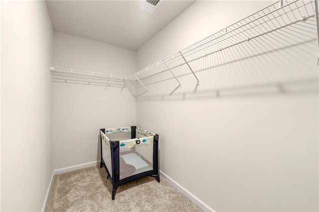 spacious closet featuring carpet