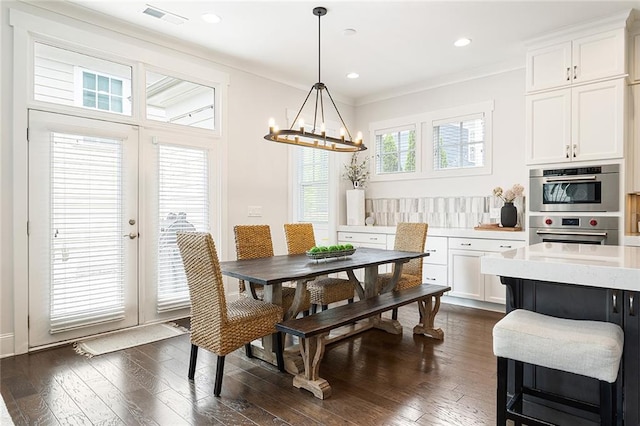 dining area with visible vents, recessed lighting, dark wood-style flooring, and a notable chandelier