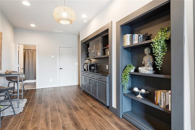 interior space with recessed lighting, baseboards, and dark wood-style flooring