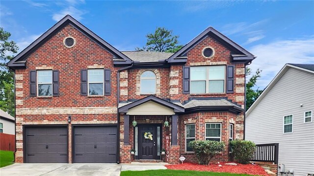 view of front of property with a garage