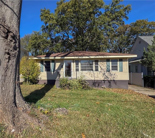 ranch-style home with a front yard