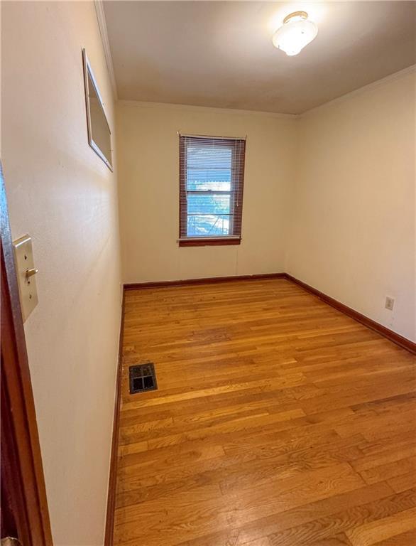 empty room with light wood-type flooring