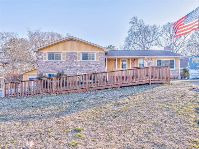 back of house with a deck and a yard