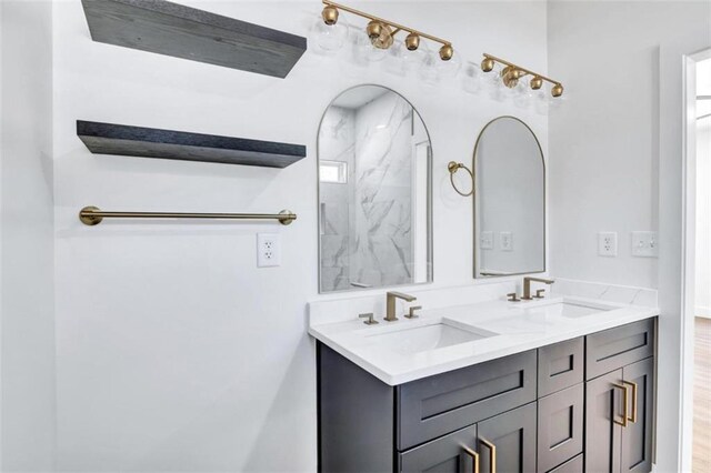 bathroom featuring dual vanity and hardwood / wood-style floors