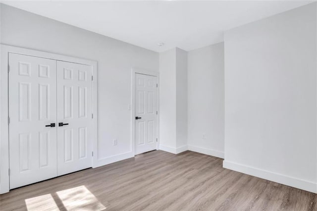 unfurnished bedroom with light hardwood / wood-style floors