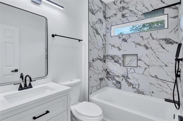 full bathroom with vanity, tiled shower / bath combo, and toilet