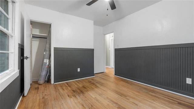 unfurnished bedroom featuring wood finished floors and a ceiling fan
