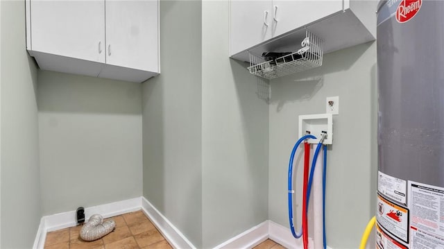 laundry area with gas water heater, cabinet space, hookup for a washing machine, and baseboards