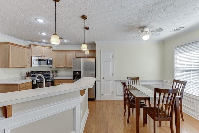 6485 Flowery Way, Flowery Branch, GA 30542 - kitchen featuring stainless steel appliances, light wood finished floors, light countertops, a ceiling fan, and light brown cabinetry