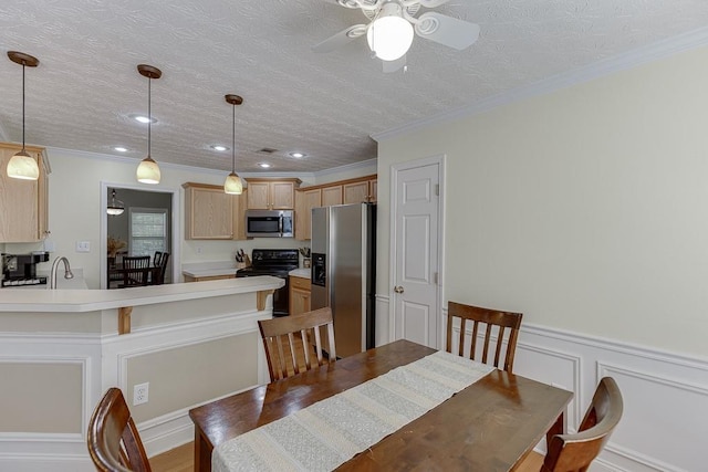 6485 Flowery Way, Flowery Branch, GA 30542 - dining room with ceiling fan, a wainscoted wall, recessed lighting, a decorative wall, and ornamental molding