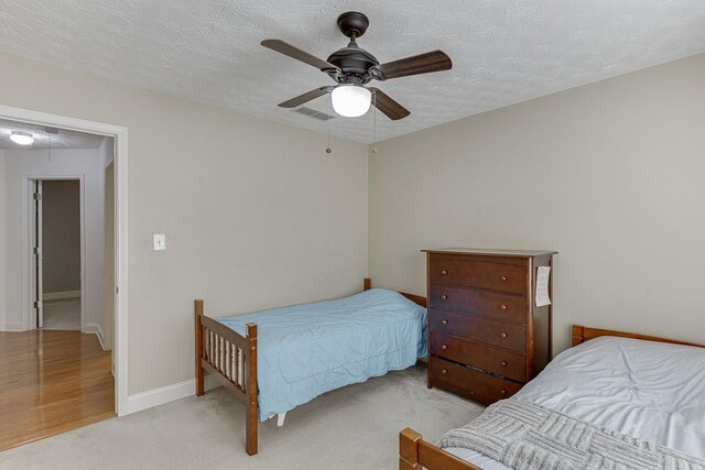 6485 Flowery Way, Flowery Branch, GA 30542 - bedroom with attic access, a textured ceiling, carpet, ceiling fan, and baseboards