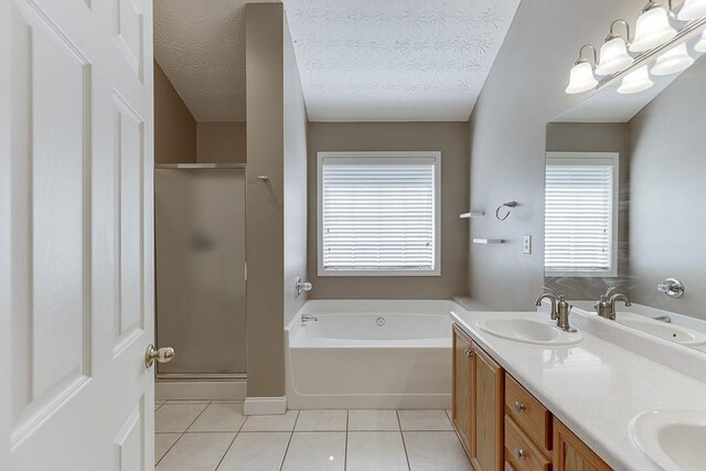 6485 Flowery Way, Flowery Branch, GA 30542 - bathroom with a garden tub, a shower stall, tile patterned flooring, double vanity, and a textured ceiling