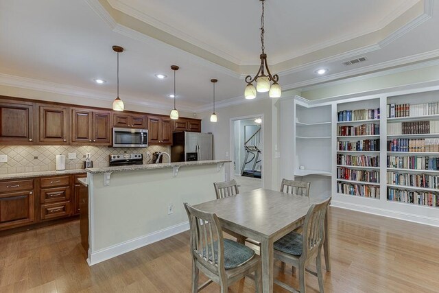 6485 Flowery Way, Flowery Branch, GA 30542 - dining area with crown molding, light wood-style floors, and recessed lighting
