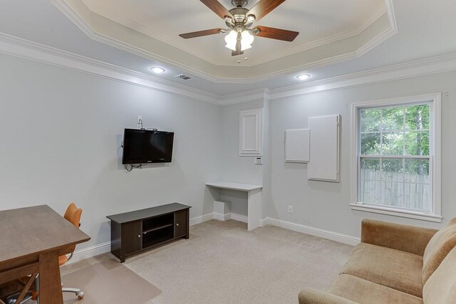 6485 Flowery Way, Flowery Branch, GA 30542 - living area with a ceiling fan, crown molding, a tray ceiling, light colored carpet, and baseboards