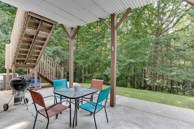 6485 Flowery Way, Flowery Branch, GA 30542 - view of patio / terrace with stairs, outdoor dining space, and a wooded view