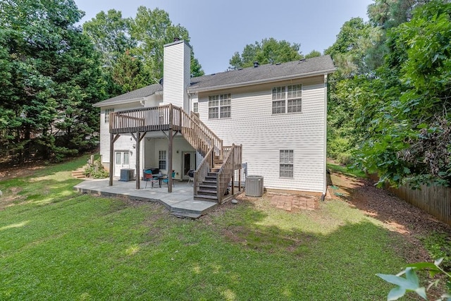 6485 Flowery Way, Flowery Branch, GA 30542 - back of property with stairway, a patio area, a lawn, central AC unit, and a deck