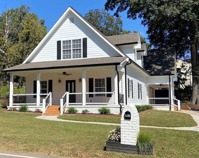 view of front of property featuring a porch, a front yard, and ceiling fan