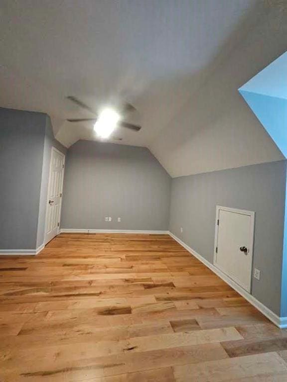 bonus room featuring lofted ceiling and light hardwood / wood-style floors