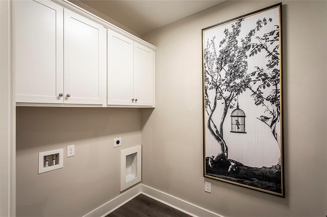 laundry room featuring cabinets, electric dryer hookup, washer hookup, and dark hardwood / wood-style flooring