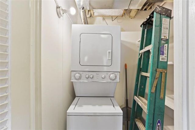 laundry room with stacked washer / dryer