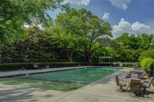 view of swimming pool featuring a pergola