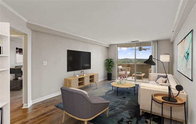 living room featuring hardwood / wood-style flooring, ornamental molding, and expansive windows