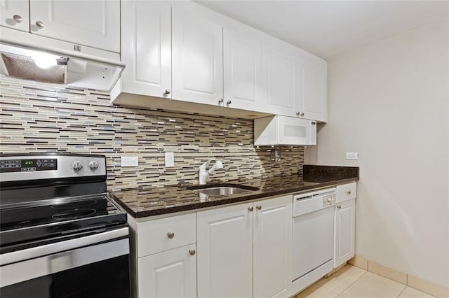 kitchen featuring sink, white appliances, and white cabinets