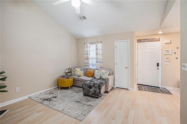 interior space featuring ceiling fan, vaulted ceiling, and light hardwood / wood-style flooring