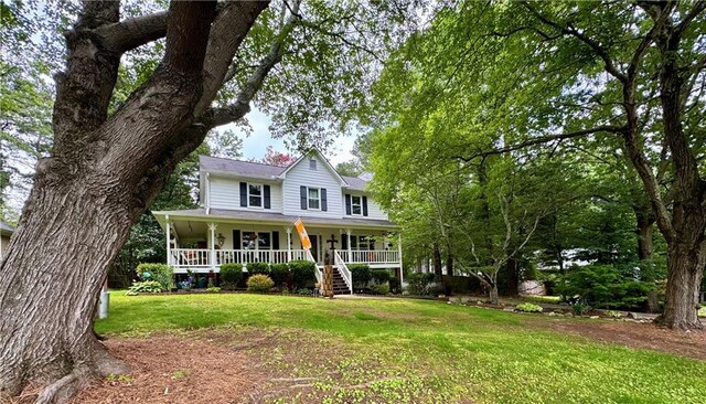 4114 Falcon Shores Ct NW, Acworth, GA 30101 - farmhouse-style home featuring a porch, a front lawn, and stairway