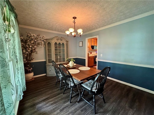 4114 Falcon Shores Ct NW, Acworth, GA 30101 - dining room featuring wood finished floors, a chandelier, a textured ceiling, and ornamental molding