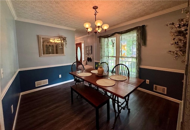 4114 Falcon Shores Ct NW, Acworth, GA 30101 - dining room with wood finished floors, a chandelier, a textured ceiling, and crown molding