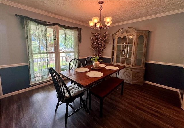 4114 Falcon Shores Ct NW, Acworth, GA 30101 - dining area with wood finished floors, a textured ceiling, a chandelier, and ornamental molding